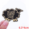 Black sheep club iron-on letter patch embroidered in black and gold thread