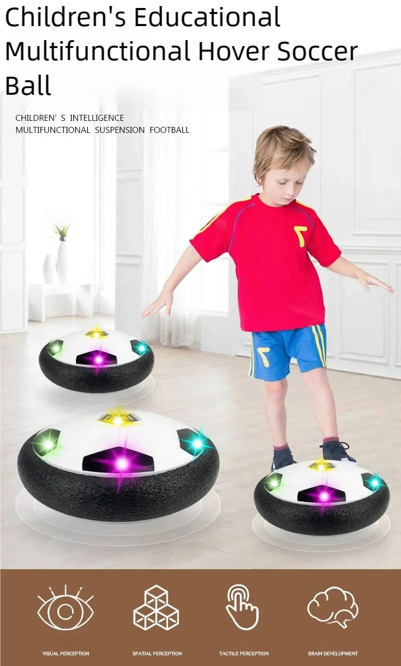 A boy is playing with a black and white multifunctional hover soccer ball in a brightly lit room.