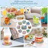 A collection of diamond art coasters featuring ocean themes and various designs displayed on a wooden table.