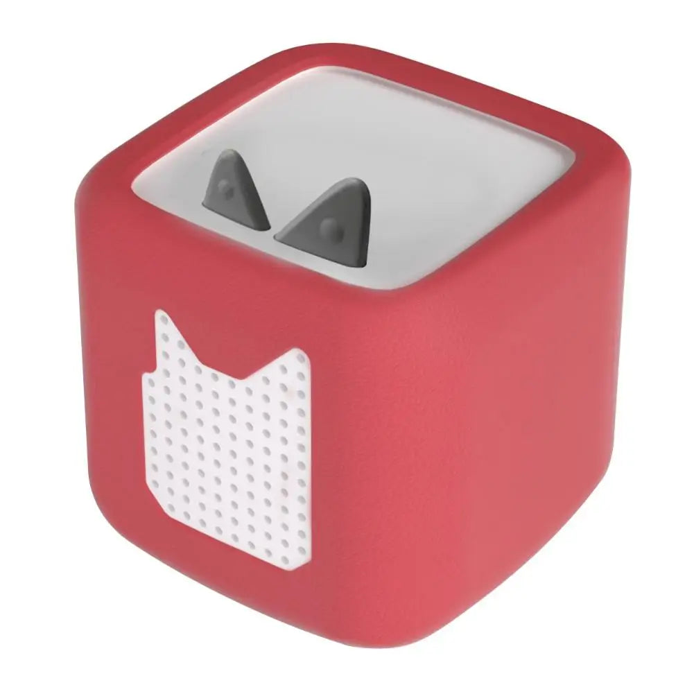 A red silicone protective case for a Toniebox 2 audio player with two visible openings.