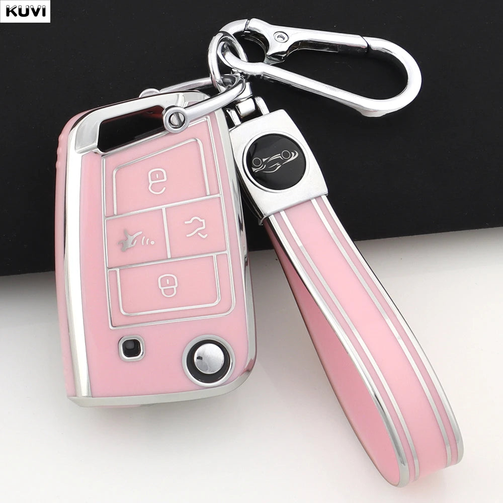 A pink and silver TPU car key cover with a metal clip attached to a keyring.