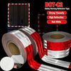Rolls of DOT-C2 safety warning reflective tape in red and white stripes shown on a black background