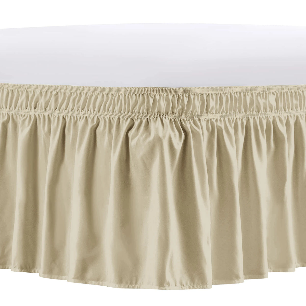 A beige adjustable wrap-around bed skirt with elegant ruffles shown from the front.