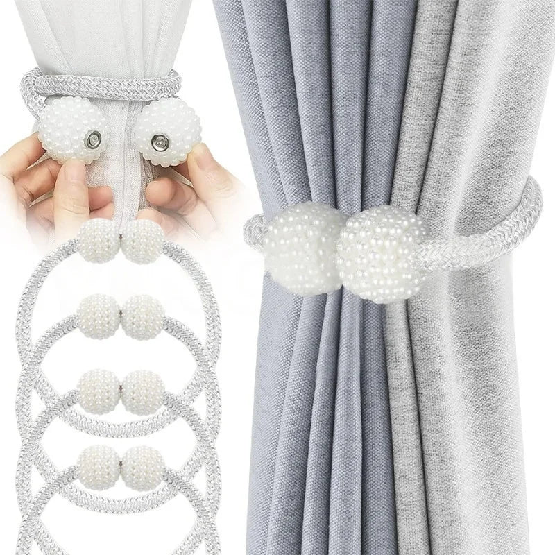 Pearl magnetic curtain tiebacks with strong hold used to secure a gray fabric drape.