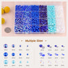 A collection of various sized flatback pearls and rhinestones in different colors packaged in a clear plastic tray.