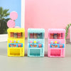 Three colorful interactive vending machine toys in yellow, blue, and pink with play coins and drinks.