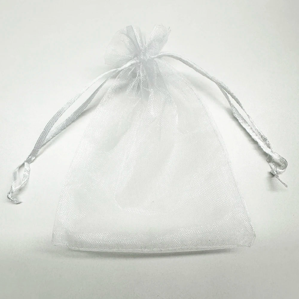 A clear white organza drawstring bag tied at the top, suitable for gifts or party favors.