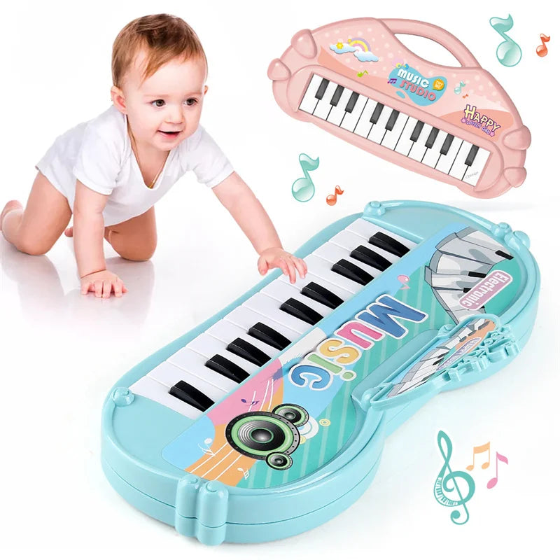 A child is playing a light blue electronic piano toy with a microphone, next to a pink version of the same instrument.