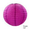 A large, round paper lantern in vibrant purple-pink color.