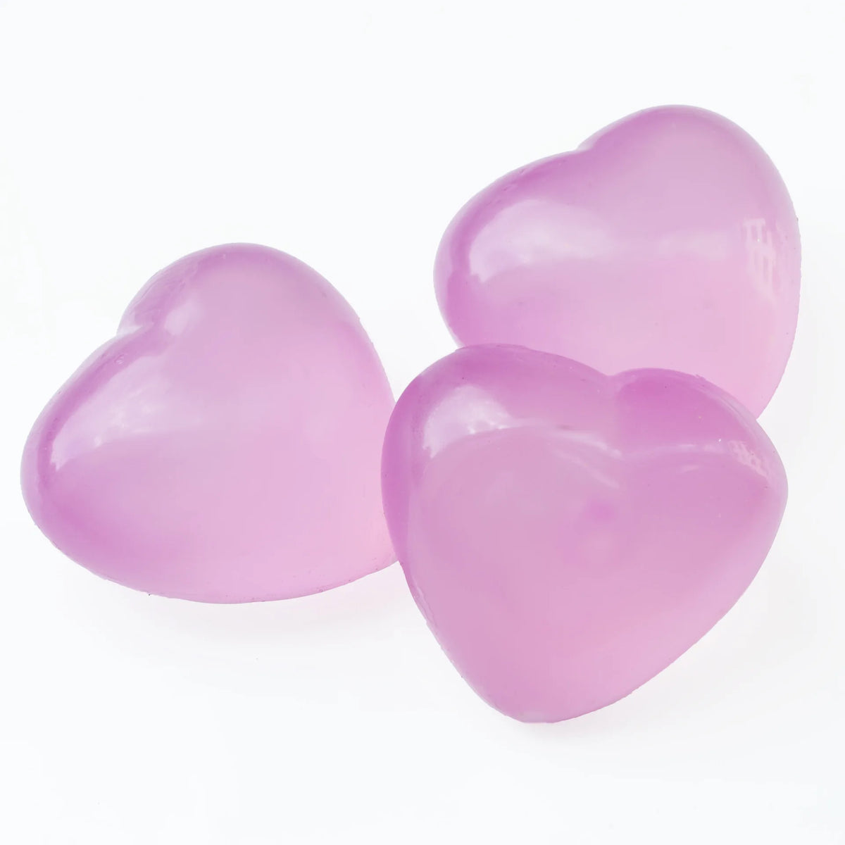 Two translucent pink heart-shaped stress relief squeeze toys