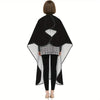 A black professional salon hair cutting cape with a gray patterned underlayer and adjustable hook.
