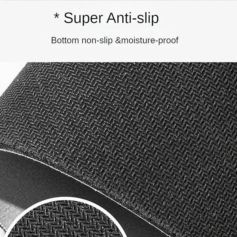 Close-up view of a black non-slip pet feeding mat with a textured surface.