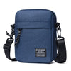 A navy blue mini crossbody phone bag with adjustable black strap and hardware.