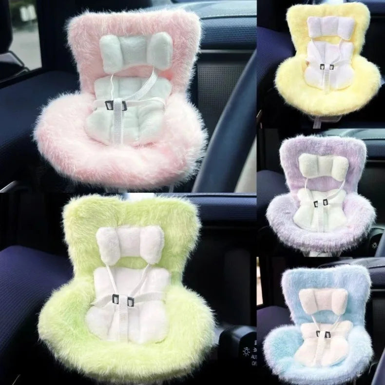 A collection of colorful miniature doll seat car vent decorations in pink, yellow, and green.