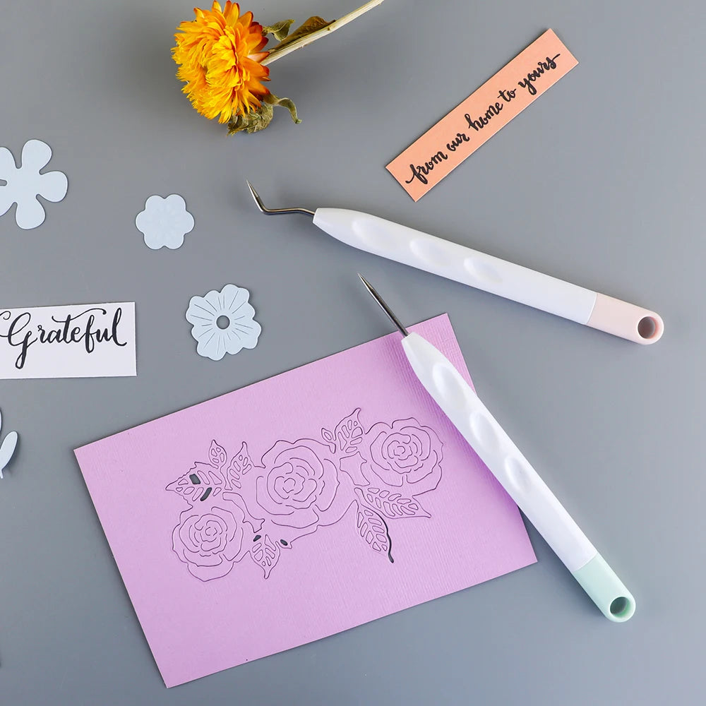 A set of six vinyl weeding and craft tools, including tweezers and a precision tool, laid on a gray surface with a pink note.