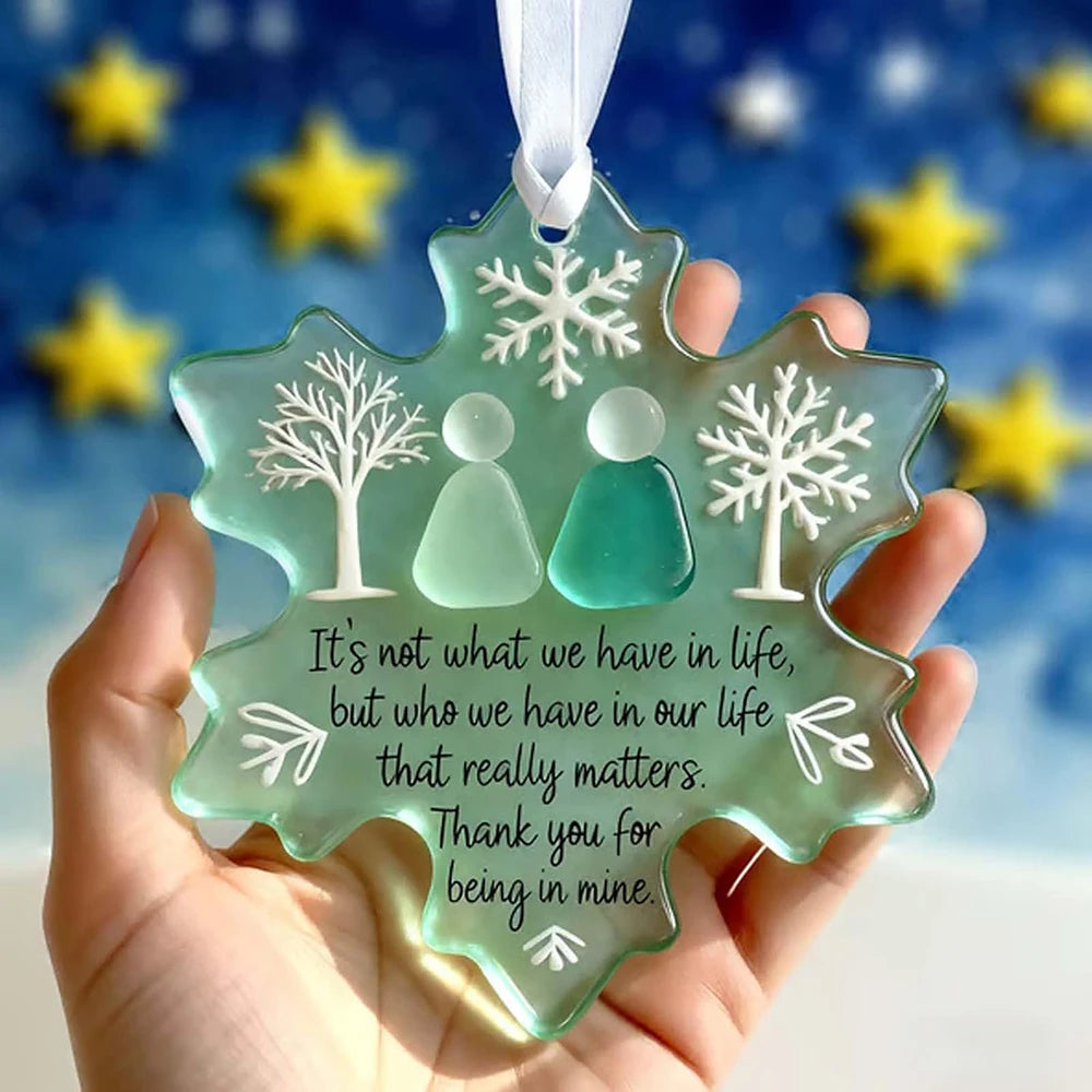 Handcrafted sea glass ornament shaped like a snowflake with a quote about who matters in life