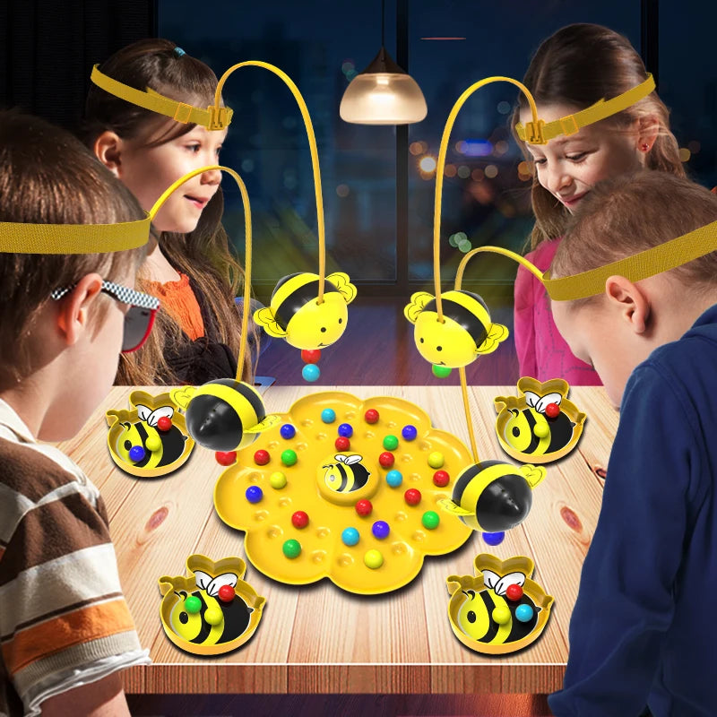 Children playing with a yellow and black jumping pirates board game on a wooden table.