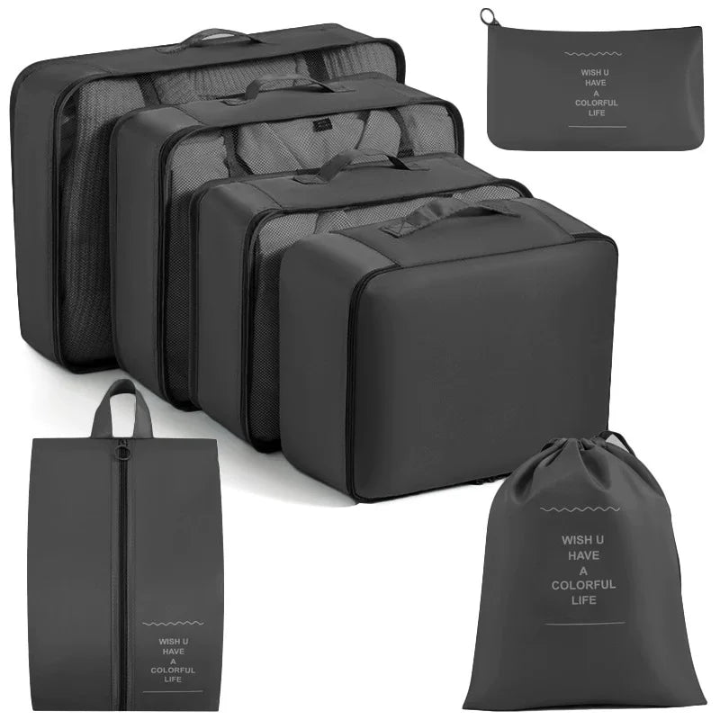 A set of black travel packing cubes and storage organizer bags for clothing.
