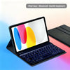 An iPad case with a detachable Bluetooth backlit keyboard shown open on a surface.