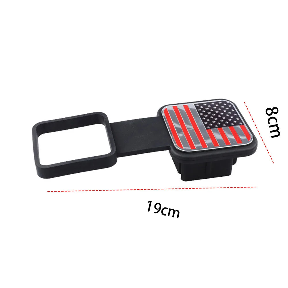 Black trailer hitch receiver cover with a red, white, and blue flag emblem