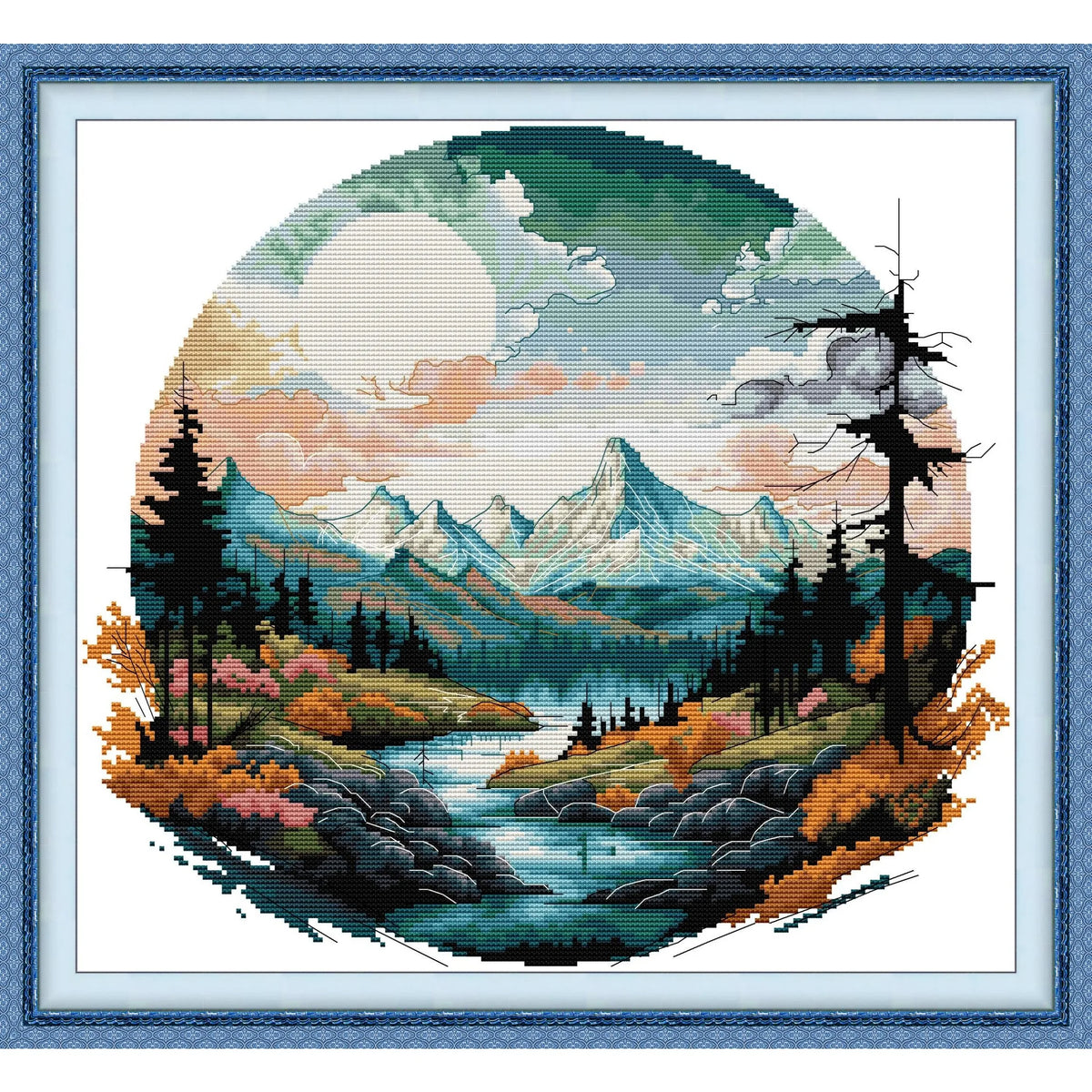 Cross stitch kit featuring an autumn mountain landscape with evergreen trees and a large sun.