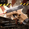 A tan Tarrant Tactical G26 pocket gun is shown in a close-up, resting on wood, with a yellow and black striped tape in the ba