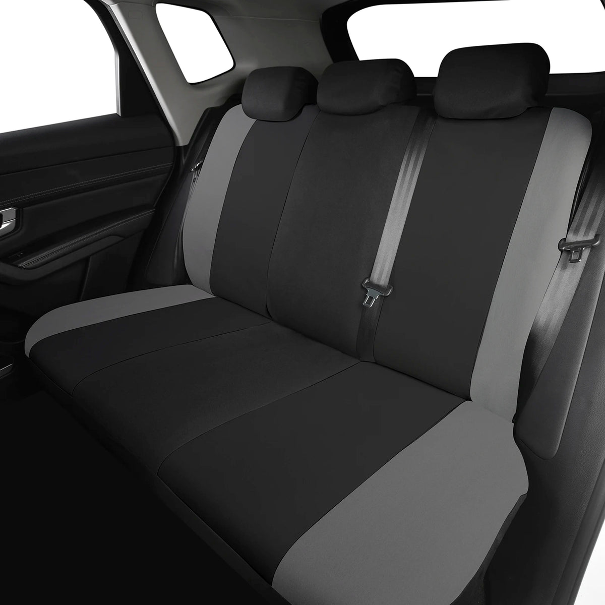A black and gray universal 9-piece car seat cover set installed on a vehicle seat.