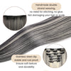 Un ensemble d'extensions de cheveux tressées en double brin gris, montrées avec une pince en acier inoxydable.