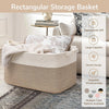 A rectangular woven storage basket in natural beige color with a light beige trim, shown on a wooden table.