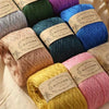 A collection of various colored pure cotton yarn skeins for knitting and crochet