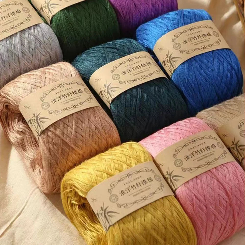 A collection of various colored pure cotton yarn skeins for knitting and crochet