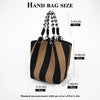 A black and tan striped hand bag is shown with various size measurements.