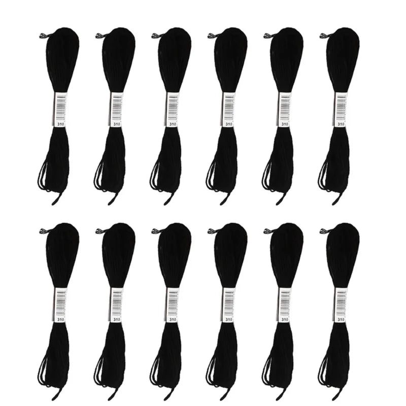 A set of 24 embroidery floss spools in white and black colors arranged in a grid.