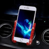 A white smartphone is held in a crystal red, textured phone holder designed for car vents.