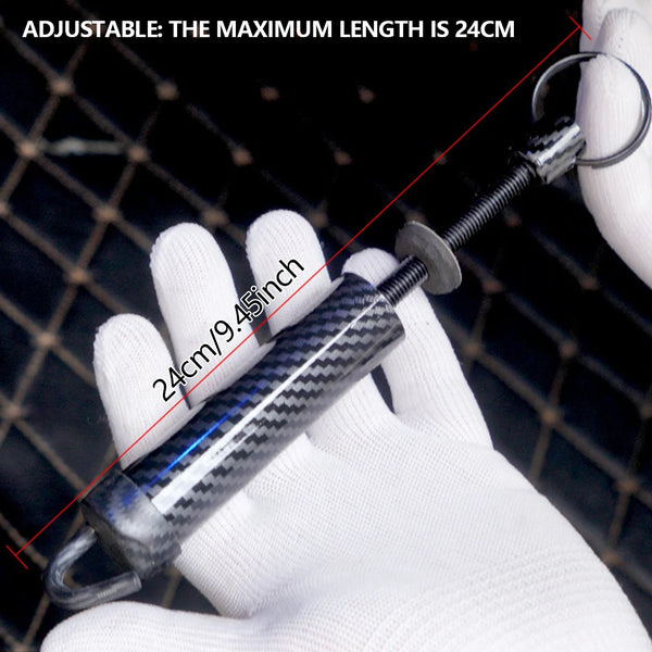A hand holds an adjustable trunk lid support spring kit, showing its length and mechanism.