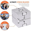 A silver metal infinity fidget cube shown with various anxiety relief and focus benefits listed around it.