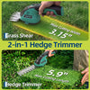 A hand holds a green and black electric grass shear and hedge trimmer, demonstrating its use for trimming grass and hedges.