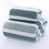 A stack of three striped gray and white microfiber bath towels.