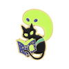 A set of enamel pins featuring a black cat silhouette on a lime green background with a glowing book detail.