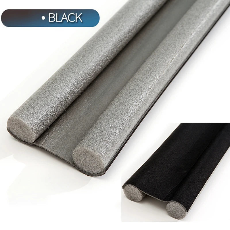 A close-up view of a black flexible door bottom seal strip and a gray version, showing the product's texture and profile.