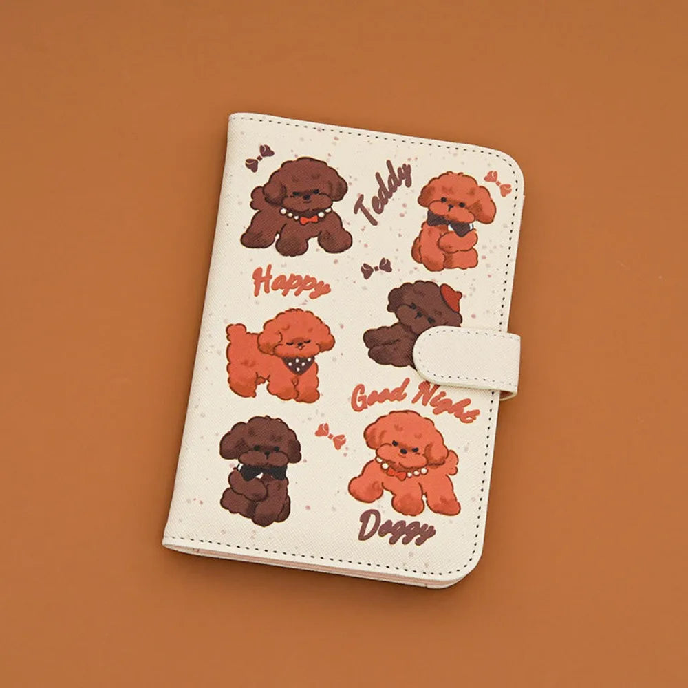 A light beige pu leather passport holder featuring cartoon dogs with happy, good night, and doggy expressions.