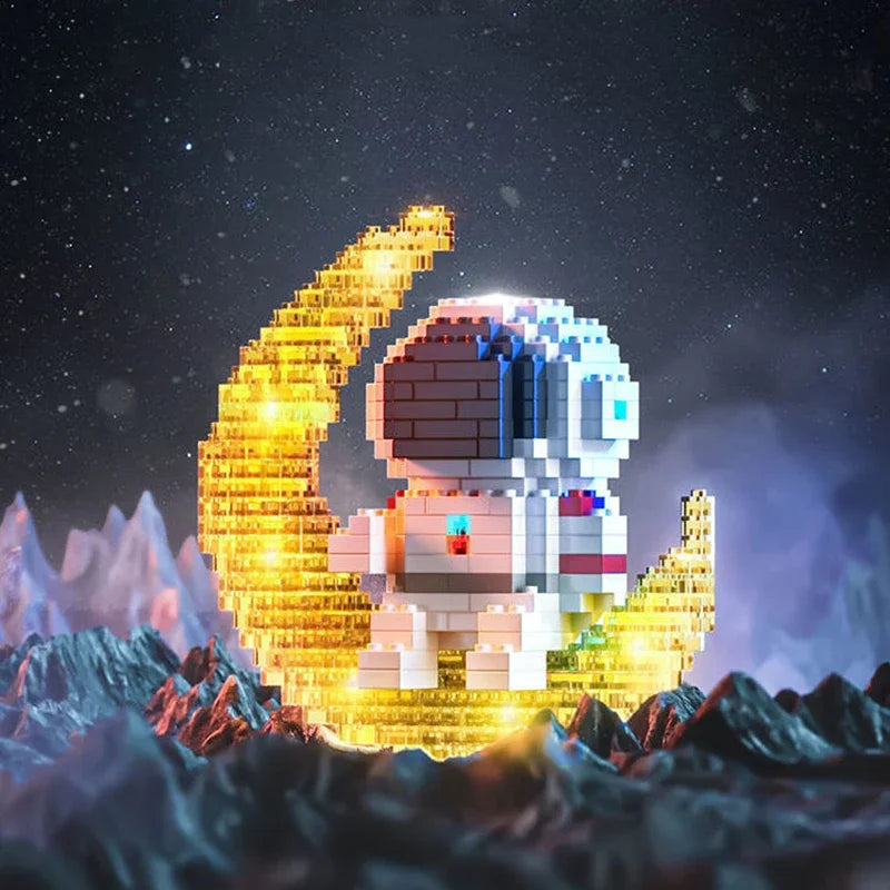 A LEGO astronaut figure shaped like a crescent moon, glowing gold, standing on a dark terrain under a starry night sky.