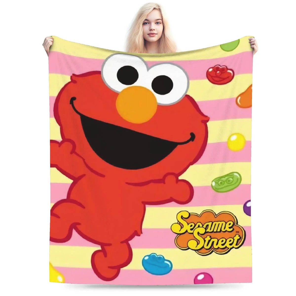 A bright orange Sesame Street character is featured on a pink striped blanket.
