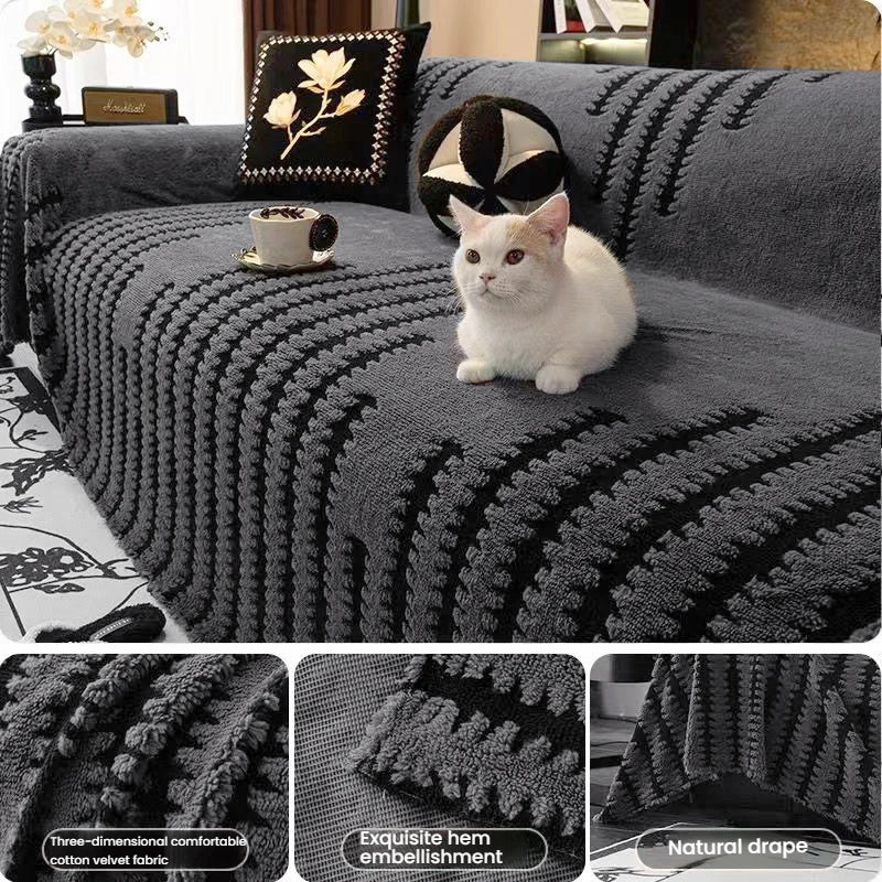 A gray woven sofa cover featuring black stripes and textured details, with a white cat sitting on it.
