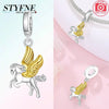 Silver pendant featuring a unicorn and pegasus charm with gold accents and sparkling crystals