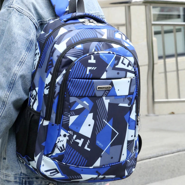 A blue and white patterned laptop backpack worn on a person's back.