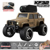 A tan RC climbing car model with a magnetic camera and remote control accessories.