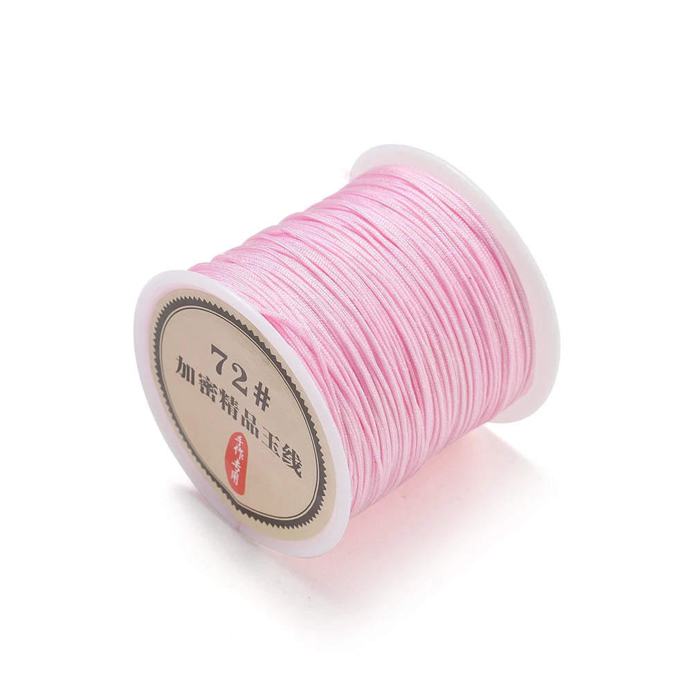 Spool of pink 0.8mm nylon macramé cord for jewelry making