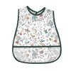 A white baby feeding bib with a dark green trim featuring a floral and leaf pattern.