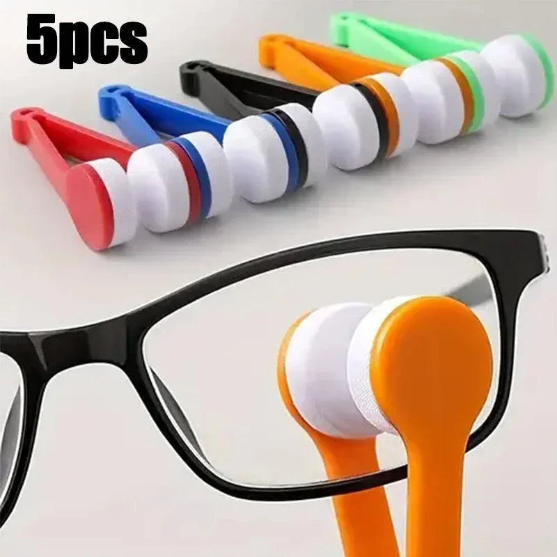 Five silicone cleaning balls for glasses and lenses shown next to a pair of black eyeglasses.